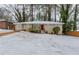 Brick ranch home with a snow-covered yard at 3426 Glensford Dr, Decatur, GA 30032