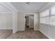 Light-filled hallway with neutral walls and wood flooring at 3426 Glensford Dr, Decatur, GA 30032