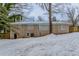 Back of house exterior view with snow on the ground at 3426 Glensford Dr, Decatur, GA 30032