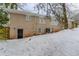 Back of house exterior with snow on the ground at 3426 Glensford Dr, Decatur, GA 30032