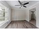 Spacious living room featuring hardwood floors and ceiling fan at 3426 Glensford Dr, Decatur, GA 30032
