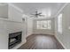 Living room with bay window, fireplace and ceiling fan at 3426 Glensford Dr, Decatur, GA 30032