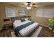 Main bedroom with king-size bed and ceiling fan at 385 Shannon Way, Lawrenceville, GA 30044