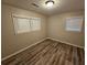 Bright bedroom with neutral walls and vinyl flooring at 385 Shannon Way, Lawrenceville, GA 30044