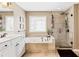 Bathroom with soaking tub, walk-in shower, and double vanity at 9706 Spyglass Dr, Villa Rica, GA 30180