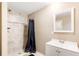 Basement bathroom with shower, tiled walls, and white vanity at 9706 Spyglass Dr, Villa Rica, GA 30180