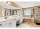 Double vanity bathroom with soaking tub and walk-in shower at 9706 Spyglass Dr, Villa Rica, GA 30180