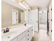 Double vanity bathroom with updated fixtures and a large mirror at 9706 Spyglass Dr, Villa Rica, GA 30180