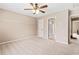 Well-lit bedroom with access to bathroom and hallway at 9706 Spyglass Dr, Villa Rica, GA 30180