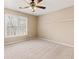 Bright bedroom featuring a ceiling fan and ample space at 9706 Spyglass Dr, Villa Rica, GA 30180