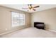 Spacious bedroom with large window and ceiling fan at 9706 Spyglass Dr, Villa Rica, GA 30180