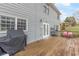 Back deck with seating area and grill, overlooking backyard at 9706 Spyglass Dr, Villa Rica, GA 30180