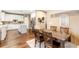 Bright dining area adjacent to kitchen with hardwood floors at 9706 Spyglass Dr, Villa Rica, GA 30180