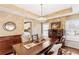 Spacious dining room with hardwood floors and large windows at 9706 Spyglass Dr, Villa Rica, GA 30180