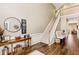 Bright entryway with hardwood floors, staircase, and console table at 9706 Spyglass Dr, Villa Rica, GA 30180