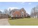 Brick house with a long driveway and mature trees at 9706 Spyglass Dr, Villa Rica, GA 30180