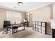 Home office with desk and built-in shelving at 9706 Spyglass Dr, Villa Rica, GA 30180