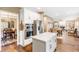 Open concept kitchen with island, stainless steel appliances, and hardwood floors at 9706 Spyglass Dr, Villa Rica, GA 30180