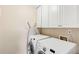 Laundry room with white cabinets, washer and dryer at 9706 Spyglass Dr, Villa Rica, GA 30180