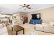 Bright living room featuring a large TV and comfortable seating at 9706 Spyglass Dr, Villa Rica, GA 30180