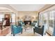 Cozy living room featuring comfortable seating and large windows at 9706 Spyglass Dr, Villa Rica, GA 30180
