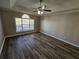 Large main bedroom with ceiling fan and arched window at 10577 Marigold Ct, Hampton, GA 30228