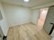 Well-lit bedroom with wood-look flooring and access to other areas at 2371 Cresta Dr, Decatur, GA 30032