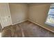 Bright bedroom featuring neutral walls and carpet at 2718 High Tide Dr, South Fulton, GA 30349