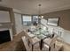 Dining room with glass table, white chairs, and area rug at 2718 High Tide Dr, South Fulton, GA 30349