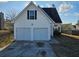 Two-car garage and neat front yard at 2718 High Tide Dr, South Fulton, GA 30349