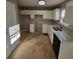 Kitchen with white cabinets, quartz countertops and tile floor at 2718 High Tide Dr, South Fulton, GA 30349