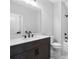 Modern bathroom with a vanity and large mirror and shower and tub combo at 515 Pearl St, Cumming, GA 30040