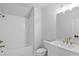 Clean bathroom with white subway tile, a bathtub, and updated fixtures at 515 Pearl St, Cumming, GA 30040