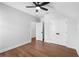 Bedroom featuring hardwood floors, ceiling fan, and a closet at 515 Pearl St, Cumming, GA 30040