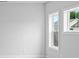 Charming bedroom with neutral walls, carpet flooring, and two windows at 515 Pearl St, Cumming, GA 30040