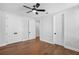Bedroom featuring hardwood floors, ceiling fan, and a closet at 515 Pearl St, Cumming, GA 30040