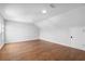 Large bonus room with hardwood flooring, neutral walls, and great natural light at 515 Pearl St, Cumming, GA 30040
