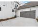 The home features a two-car garage with modern doors and exterior lighting at 515 Pearl St, Cumming, GA 30040