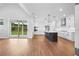 Spacious kitchen and living area with hardwood floors and backyard view at 515 Pearl St, Cumming, GA 30040