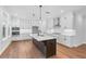 New kitchen with white cabinets, stainless steel appliances and granite counter tops at 515 Pearl St, Cumming, GA 30040