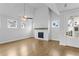 Bright living room with hardwood floors, fireplace, and high ceilings at 515 Pearl St, Cumming, GA 30040
