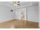 Large main bedroom with hardwood floors and ensuite bathroom access at 515 Pearl St, Cumming, GA 30040