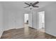 Bright bedroom with wood-look floors and ceiling fan at 346 Carpenter Dr # 51, Atlanta, GA 30328