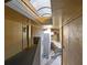 Well-lit condo hallway with skylights and access to individual units at 346 Carpenter Dr # 51, Atlanta, GA 30328