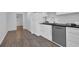 Updated kitchen featuring white cabinetry and stainless steel appliances at 346 Carpenter Dr # 51, Atlanta, GA 30328