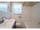 Clean bathroom with white tile, bathtub, and updated vanity at 3211 Sandusky Dr, Decatur, GA 30032
