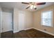 Bedroom with hardwood floors, double closet, and window at 3211 Sandusky Dr, Decatur, GA 30032