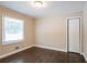Spacious bedroom with dark hardwood floors and neutral walls at 3211 Sandusky Dr, Decatur, GA 30032