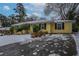 Ranch style home with snow covered yard at 3211 Sandusky Dr, Decatur, GA 30032