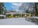 Yellow house with snow covered lawn at 3211 Sandusky Dr, Decatur, GA 30032